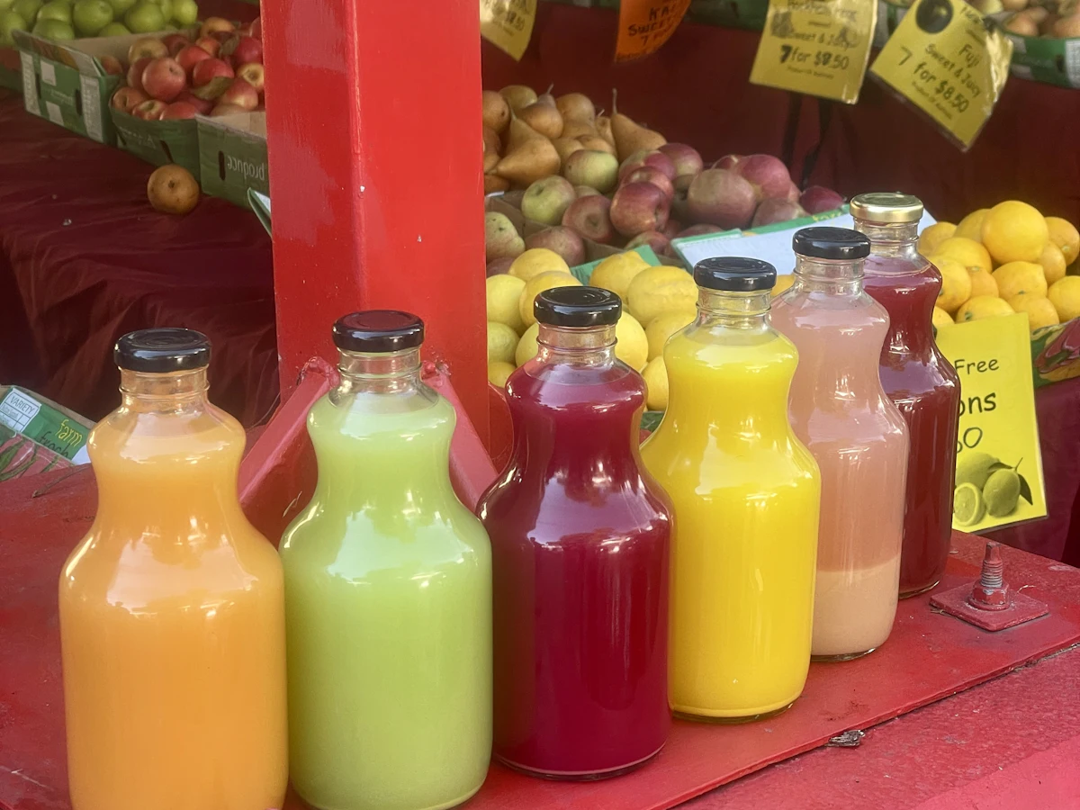 A row of colourful juice bottles