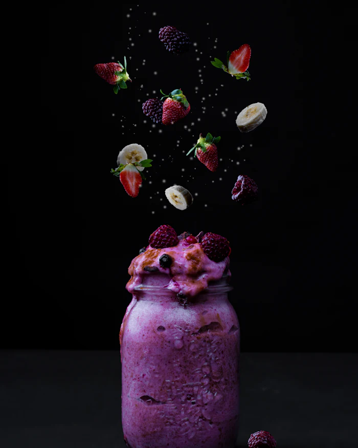 A purple smoothie in a glass jar